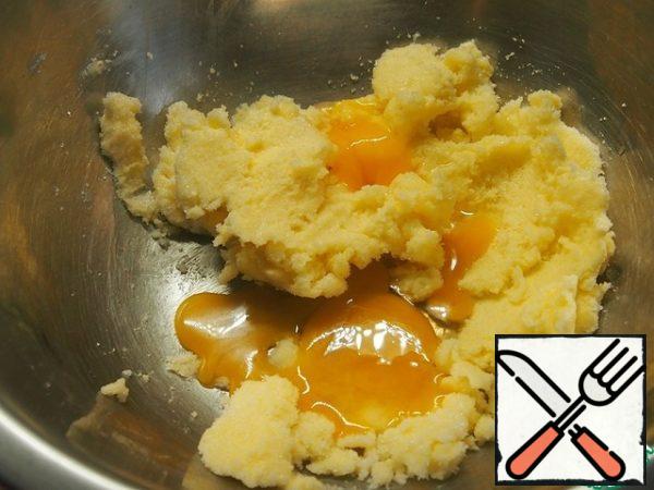 Add the egg yolks.