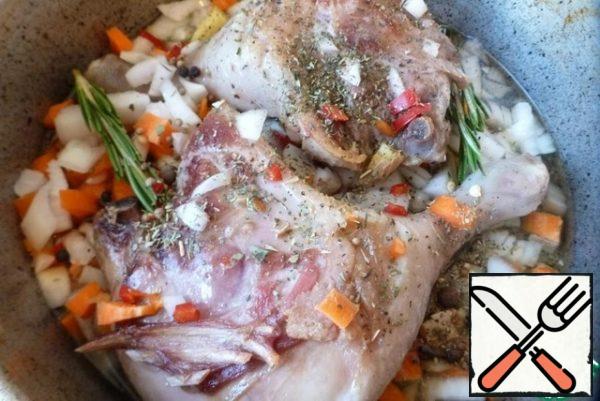 Put the vegetables and spices in the pan with the duck and fry for 5 minutes. then pour in the wine. Reduce the heat to a minimum and simmer the duck legs under the lid for 2.5-3 hours until the meat is soft. It should literally slide off the bones. During this time, turn the legs several times and add a little water (or broth), if necessary. But it is better that the meat languishes weakly in its own fat.