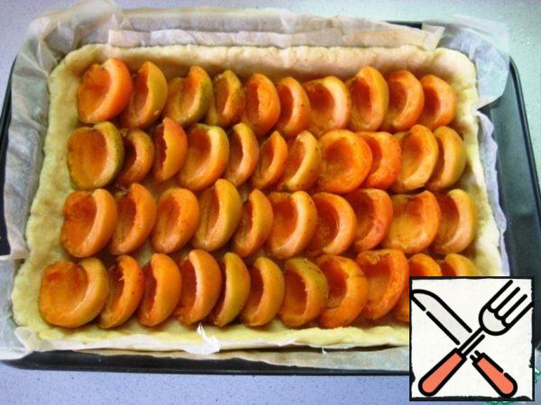 Put the apricot halves on top.