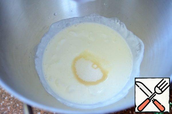 Mix yogurt, cream, warm water, add sugar and salt.