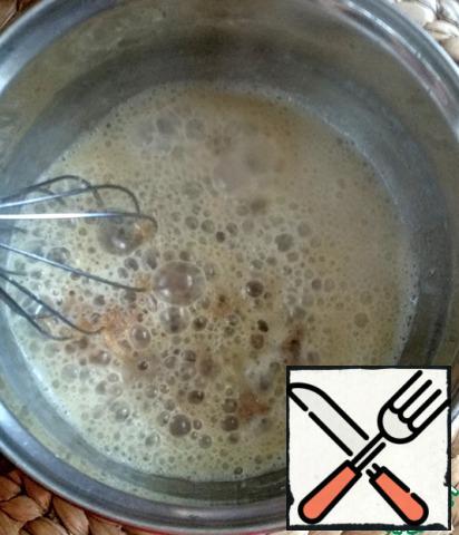 Then pour in very hot milk, the liquid will start to boil, stir intensively until smooth without removing from the heat.