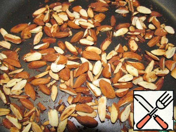 Fry the almond plates in a dry pan.