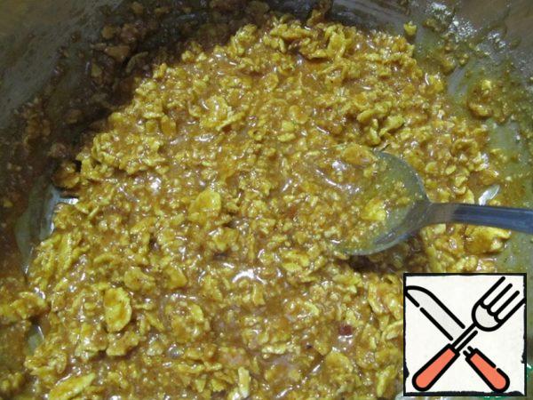 Add the cream and butter and bring to a boil (stirring constantly). Remove from the heat, allow to cool slightly, then stir in the almond and cornflake mixture. Stir quickly and thoroughly.