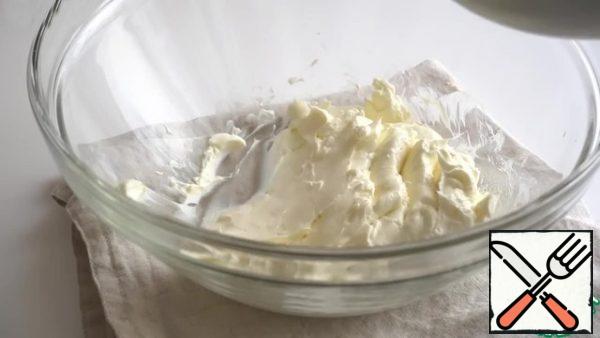 Place the cream cheese at room temperature in a bowl and stir.