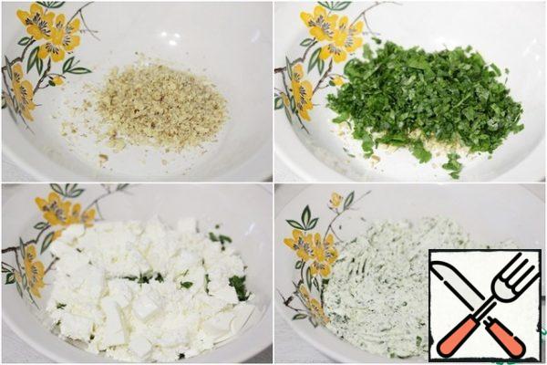 Finely chopped walnuts, chopped herbs, crushed garlic and crumbled cheese mix until smooth-by hand or using a blender.