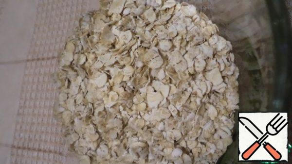Pour oatmeal into a glass.