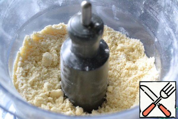 In a blender, mix flour, salt, and cooled butter.