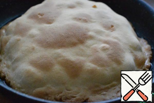 Cover the potatoes with dough. Press lightly.
Bake the tart in the preheated oven at 180*C for 30 minutes.
The dough on top should be well browned.