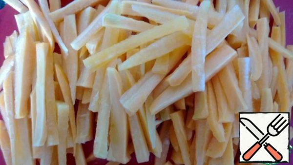Cut carrots into strips.