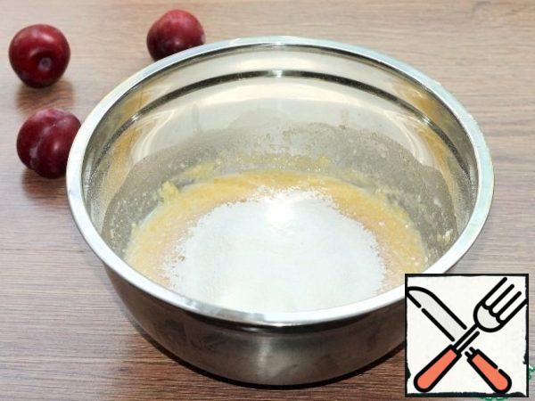 Add flour to the liquid mixture in small portions.