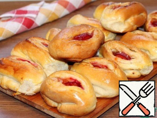 Then grease the pies with beaten egg yolk and put them in the oven for 2-3 minutes until Golden brown.
Ready-made pies are sprinkled with water and left to cool under a towel.

