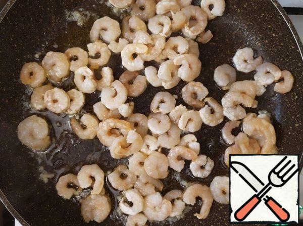 Add the shrimp and increase the heat to medium. Cook for a couple of minutes, stirring.