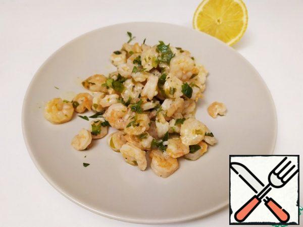 Serve with the remaining parsley and lemon.
