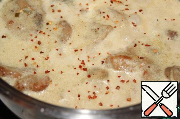 Pour in the cream, bring to a boil and reduce the heat to low and simmer for another 8-10 minutes, periodically turning the pan in your hands clockwise. Remove from heat and let stand for 10 minutes.