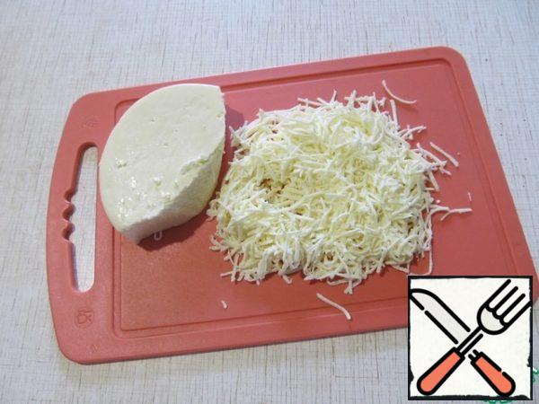 Grate the cheese on a fine grater.

The recipe requires layered cheese, such as Suluguni.