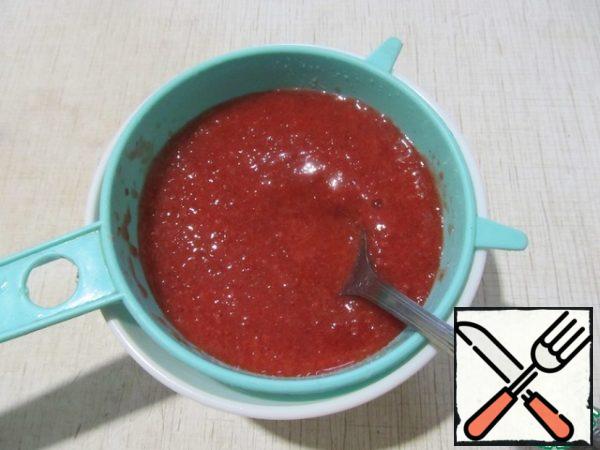 RUB the strawberry puree through a sieve.