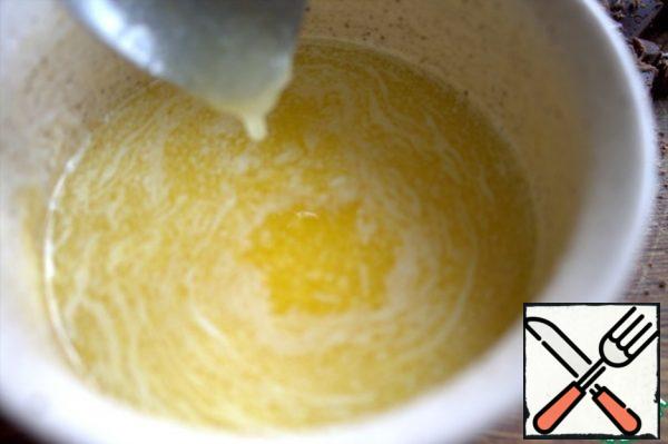 Melt the butter in a water bath.