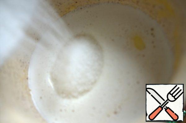Add sugar to the hot oil and stir until dissolved.