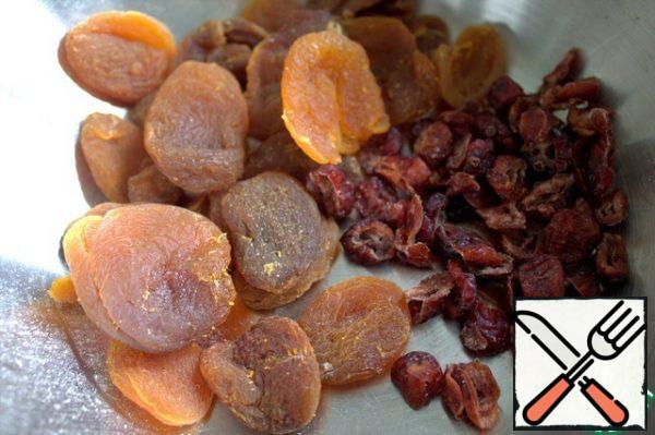 Cut the dried apricots or prunes (or both) into small pieces.