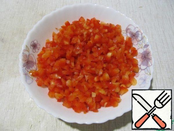 Peel the peppers and cut them into small cubes.