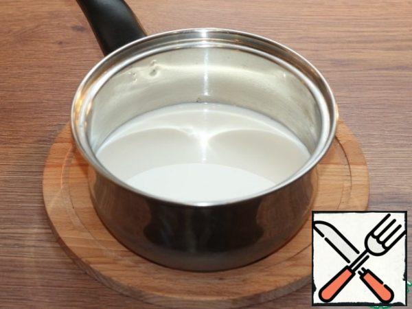 Pour the milk into a saucepan and bring to a boil.