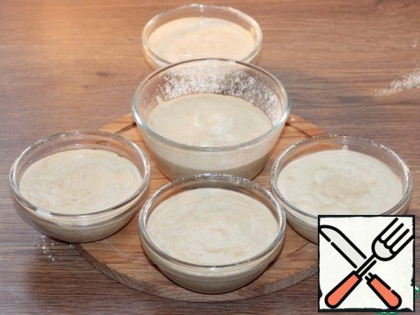 Put the souffle in the molds and place in a deep baking tray. Pour hot water ~ 2 cm high into a baking tray and place in a preheated 180 C oven.