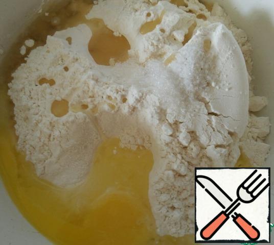 Pour the dough ingredients into a deep bowl and knead the dough.