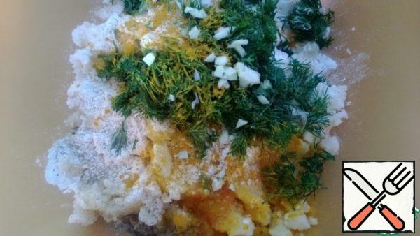 To the mashed potatoes, add flour, egg, herbs, salt, pepper, turmeric, finely chopped garlic, and mix until smooth.
