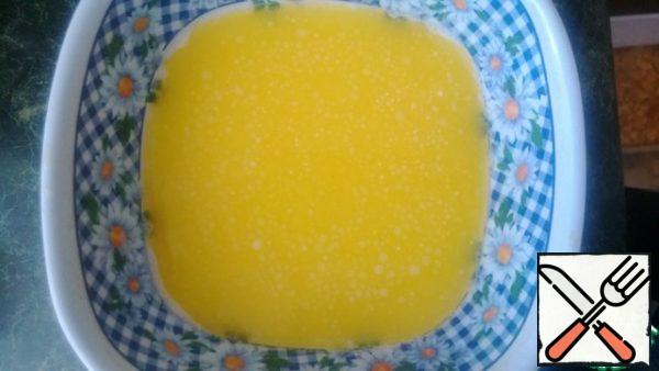 Melt the butter in a water bath.