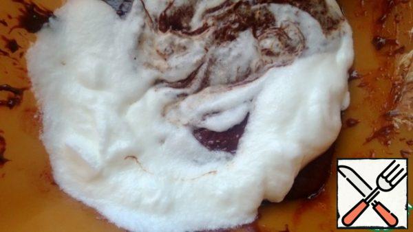 Whipped whites are introduced little by little into the chocolate mixture, mix only with a spatula (not a mixer).