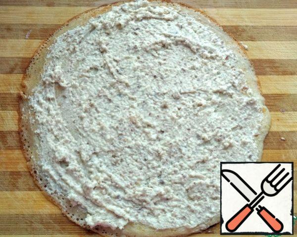 Grease each pancake with cottage cheese filling.