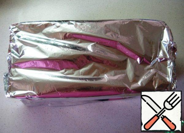 Cover the form with foil and send it to a preheated 180 degree oven for 1.5 hours.