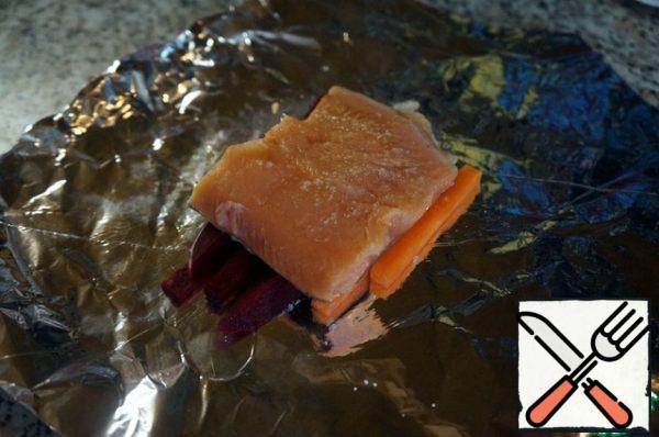 On them – fillet skin-side down, season with a little salt and pepper.