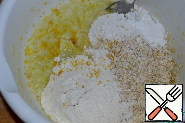 Add flour, flakes, baking powder and zest.
Stir and let stand for 5-7 minutes.