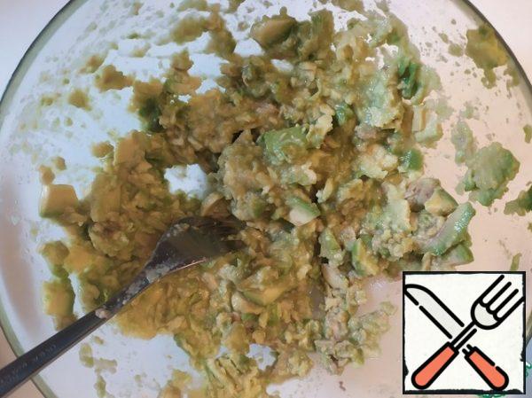 Slice and mash the avocado.