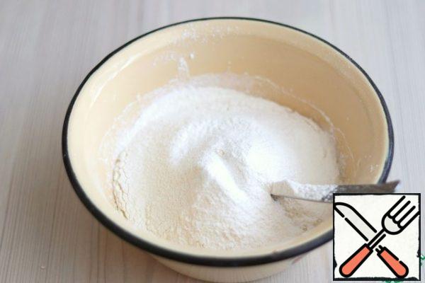 Next, add the total amount of sifted and mixed with vanilla (1/3 teaspoon) flour (180 gr.), add baking powder (1 teaspoon). Knead a smooth and soft dough. Cover the dough with cling film and leave for 15-20 minutes.