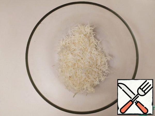 When the spaghetti is almost ready, take some more water from them and add it to the grated cheese. Stir it to the consistency of a thick sauce.