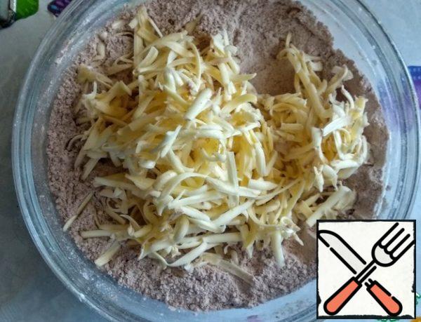Grate the butter on a coarse grater.