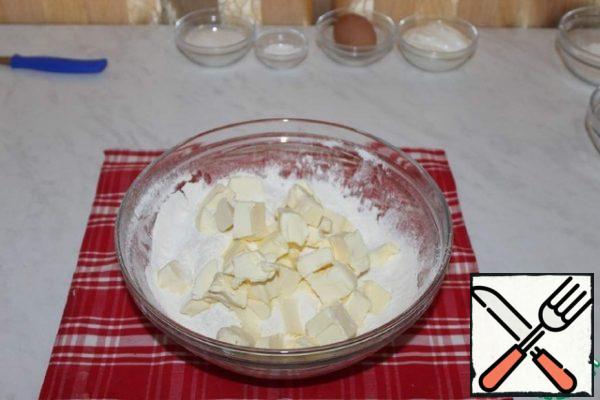 Add cold butter to the sifted flour. Grind into crumbs.