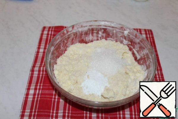 Add sugar, salt, baking powder and soda. Mix well.