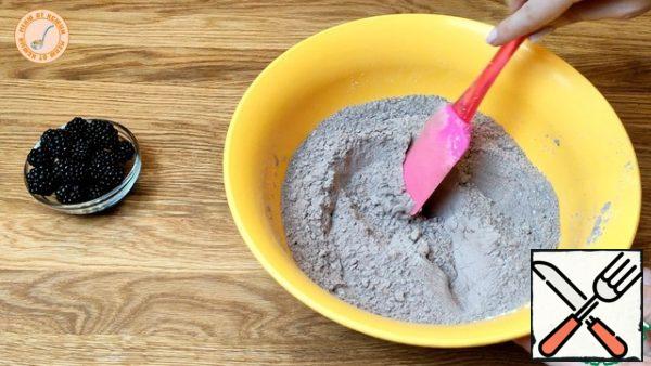Add baking powder and cocoa to the flour. Stir.