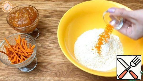 Add starch to the flour. Here is the oil from the refrigerator and grind into crumbs with a blender. Add the baking powder and dry orange zest.