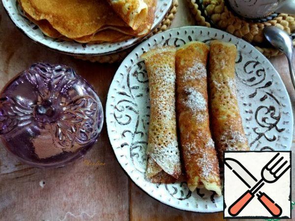 To serve, I rolled the pancakes into tubes and sprinkled them with powdered sugar and cinnamon. Pancakes can be served with whatever you want!