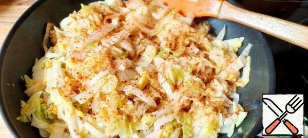 Add a little salt and pepper to the cabbage and add red sweet paprika.