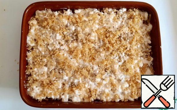 Sprinkle with bread and nut crumbs and send to the preheated oven to 200 degrees for half an hour. Watch the process, everyone has different ovens.
