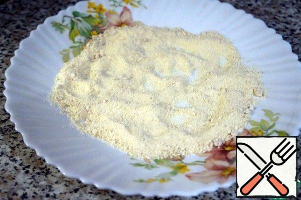 In a flat dish, pour the flour, add salt and white pepper, and mix.