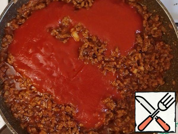 Add the tomato sauce and stir.