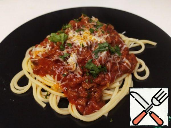 Prepare the spaghetti. Put them on a plate, pour the sauce on top, and sprinkle with Parmesan.

Bon appetit.