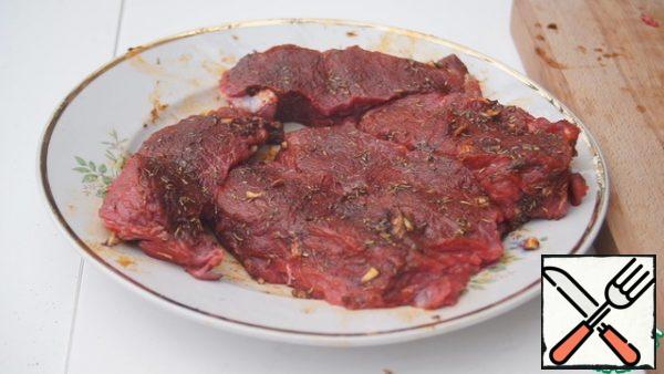 Place the steaks on a platter and brush with the marinade. Leave for about an hour.