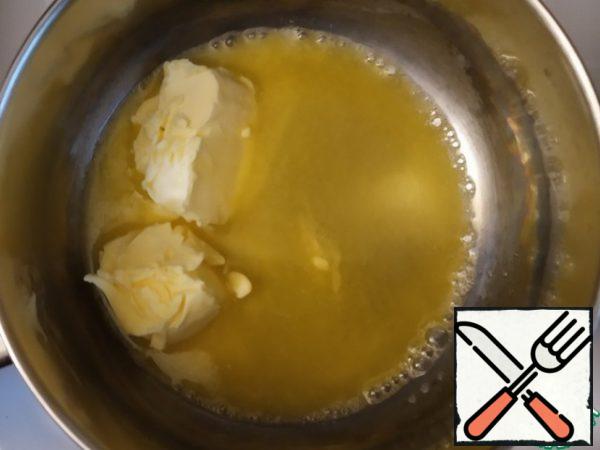 Melt the butter in a water bath.